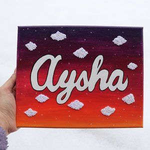 Handmade Personalized Name Canvas with sunset and embroidered cloud background.